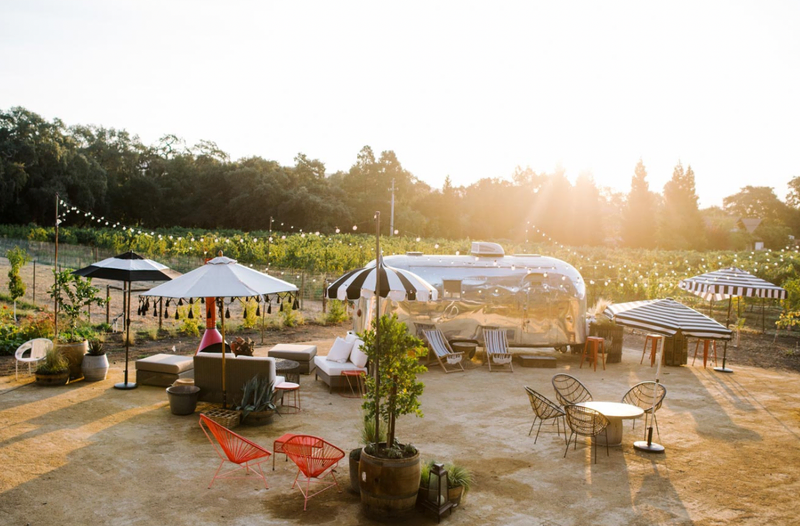 A sunlit view of the patio seating at Hoopes Vineyard | Women Owned Wineries